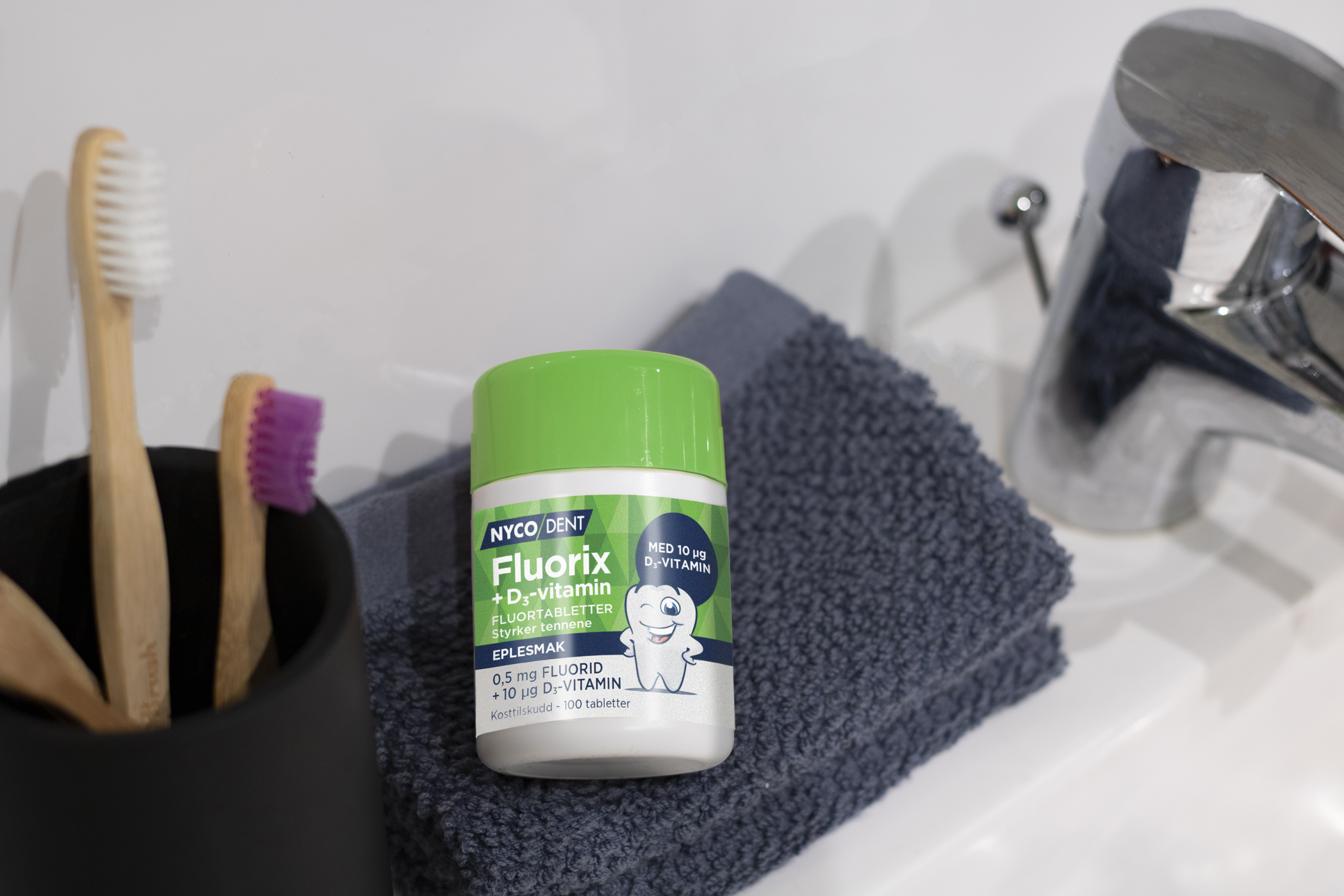 Nycodent Fluorix 0,5 mg + D-vitamin eple, 100 stk.