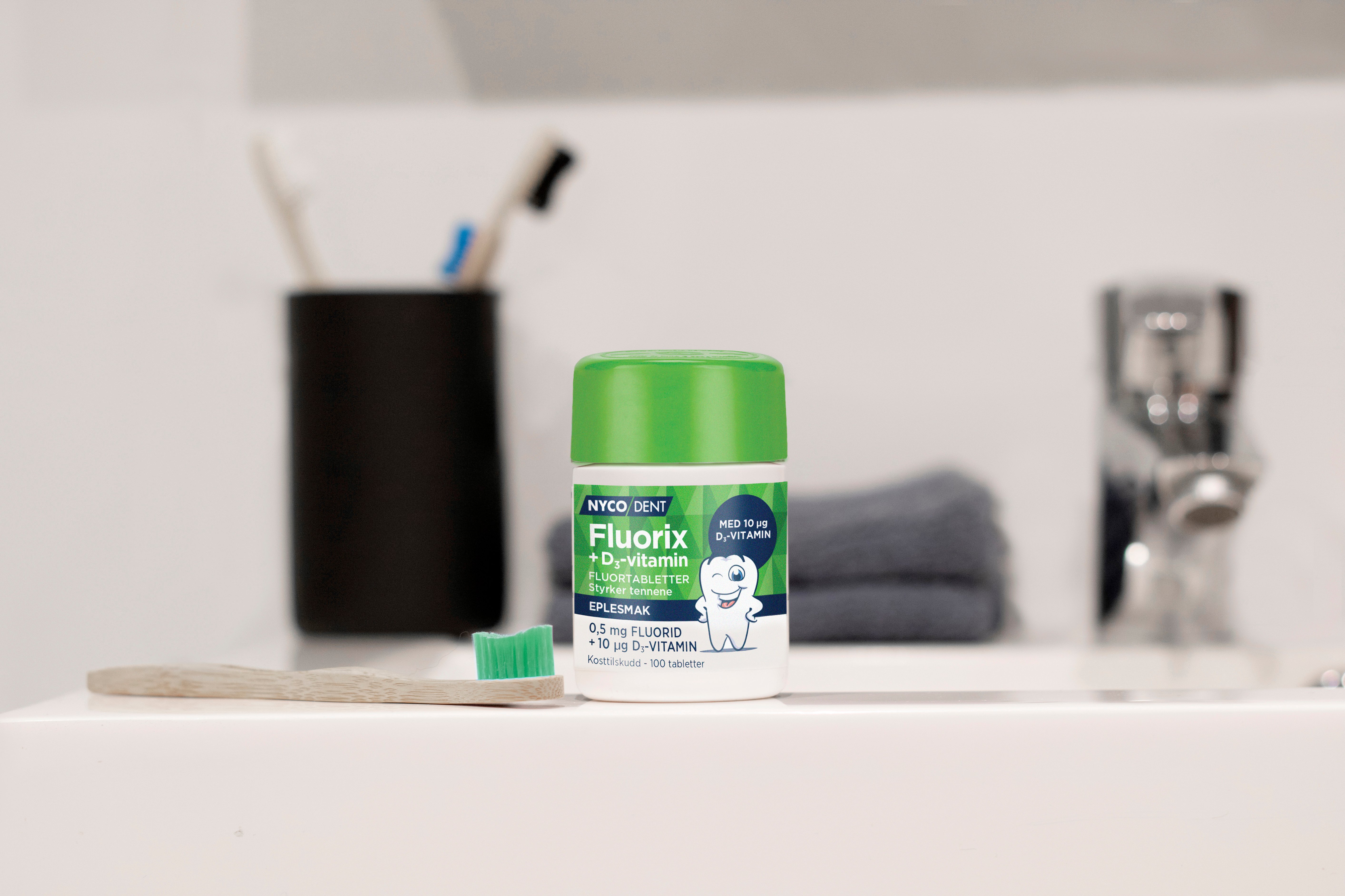 Nycodent Fluorix 0,5 mg + D-vitamin eple, 100 stk.